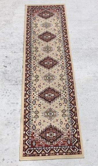 A FABULOUS 2.6m LONG "KHALAF ORIENT" RUNNER CARPET IN DARK BROWN AND TAN COLOURS