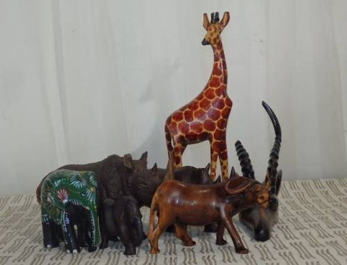 A STUNNING COLLECTION OF SIX WOODEN CARVED ANIMAL FIGURINES INCLUDING A STUNNING PAINTED ELEPHANT