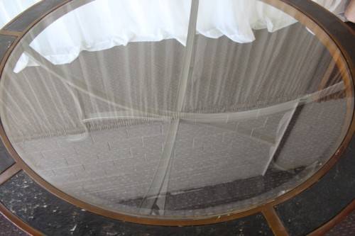 A SPECTACULAR (LARGE) ROUND 6-SEATER PATIO TABLE WITH A BEVELED GLASS TOP AND AMAZING DETAILING