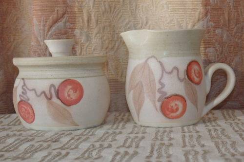 **RS17** A stoneware milk jug and lidded sugar bowl set with gorgeous hand painted detailing