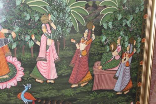 A STUNNING LARGE (1.5m x 1m) PAINTING OF THE HINDU GOD KRISHNA PLAYING THE FLUTE IN A GARDEN