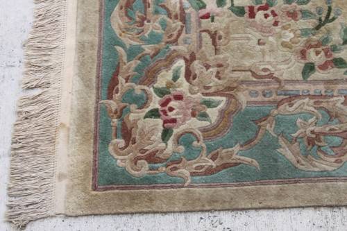 A WONDERFUL ANTIQUE PURE WOOL PILE CARPET (2.9m x 1.8m) WITH GREENS, PINKS, TANS AND EARTHY TONES