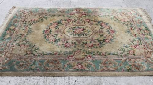 A WONDERFUL ANTIQUE PURE WOOL PILE CARPET (2.9m x 1.8m) WITH GREENS, PINKS, TANS AND EARTHY TONES