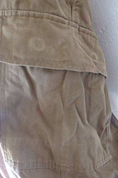 A GREAT PAIR OF GREEN/ BROWN MILITARY CARGO PANTS WITH BELT IN WONDERFUL CONDITION