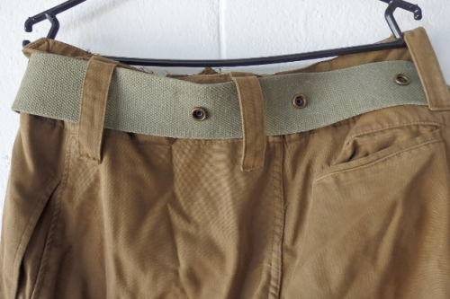 A GREAT PAIR OF GREEN/ BROWN MILITARY CARGO PANTS WITH BELT IN WONDERFUL CONDITION