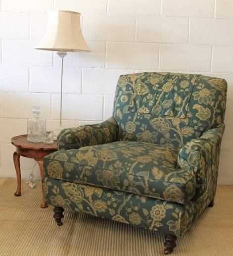 A beautiful "oversized" comfortable vintage arm chair on its original castors in fabulous condition
