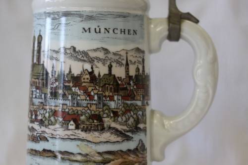 An awesome vintage white German made ceramic (lidded) Stein with "Munich" related transfer prints
