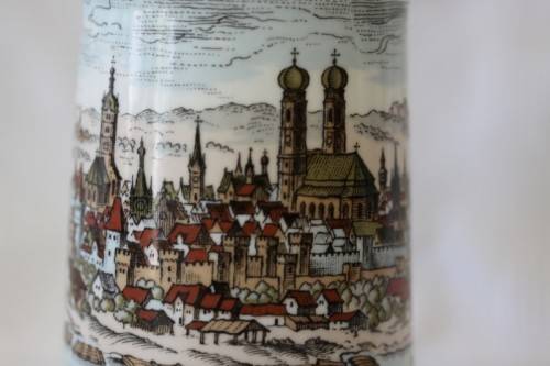 An awesome vintage white German made ceramic (lidded) Stein with "Munich" related transfer prints