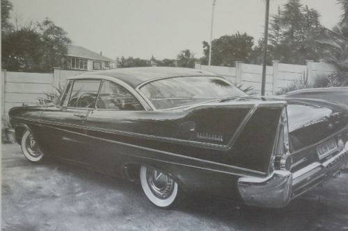 A signed limited edition print (no. 224/ 250) of a 1958 Plymouth Belve by Dean Scott Simon RS17