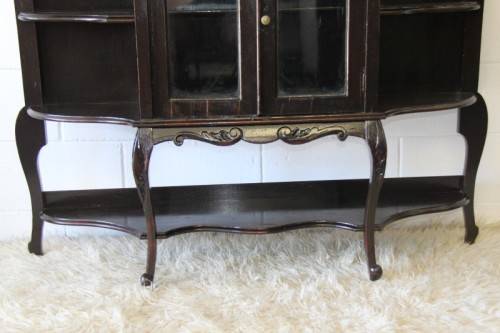A magnificent display cabinet with a beveled mirror, cupboards and loads of shelf space