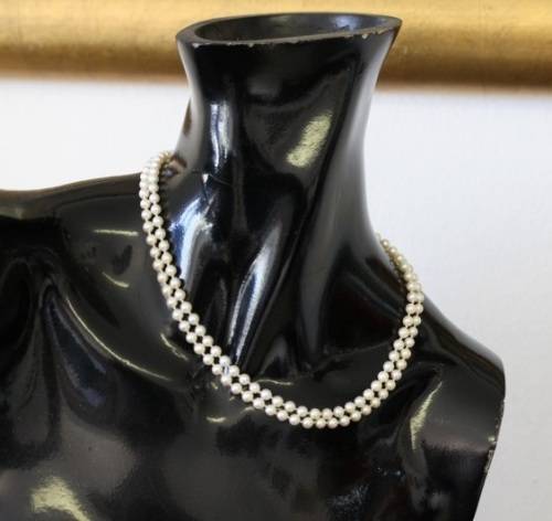 A spectacular double-strand pearl necklace with a sterling silver engraved clasp & pearl earrings