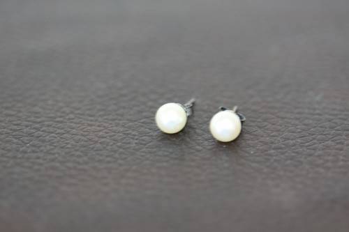 A spectacular double-strand pearl necklace with a sterling silver engraved clasp & pearl earrings