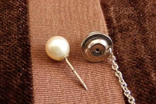 A stunning vintage genuine "Akoya" cultured white pearl gentleman's tie tack in its original box