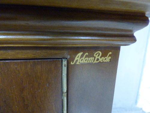 An exquisite vintage Teak 'Adam Bede' bookcase/showcase with a double door bottom cabinet.Stunning!!