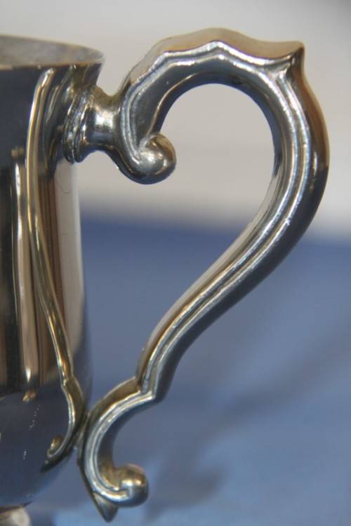 An awesome pair of silver plated mugs with ornate handles in stunning condition