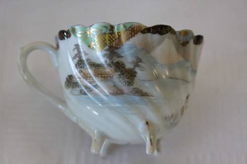 Two rare antique Japanese "translucent" porcelain teacups and saucers with amazing hand painted work