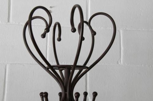 A stunning tall wrought iron coat rack/ hat stand with loads of space in very good condition