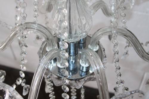 A superb and expensive crystal chandelier with curved glass arms and 6x light fittings = wow!!!