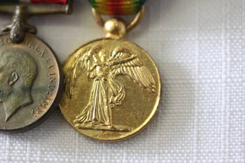 Four magnificent antique miniature ribboned military medals in very good condition