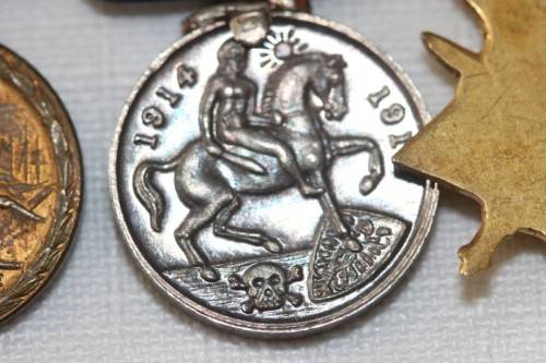 Four magnificent antique miniature ribboned military medals in very good condition
