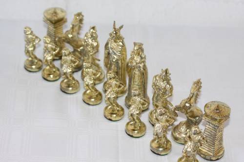 An amazing vintage/ antique? cast iron "Viking" silver & gold plated chess set in its original box