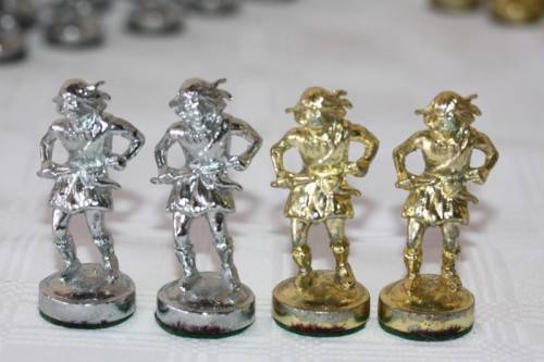 An amazing vintage/ antique? cast iron "Viking" silver & gold plated chess set in its original box