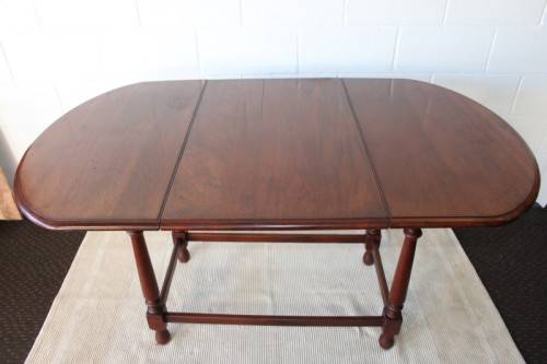 A wonderful solid teak "drop-leaf" table w/ side panels, very compact and perfect for limited space
