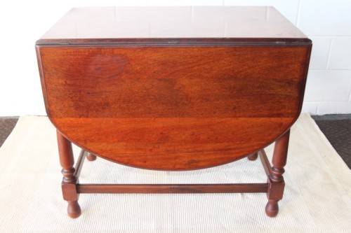 A wonderful solid teak "drop-leaf" table w/ side panels, very compact and perfect for limited space