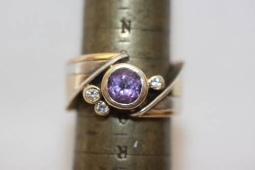 A beautiful 14ct yellow gold and sterling silver ladies ring w/ diamonds and a large Amethyst stone