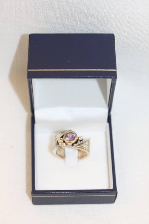 A beautiful 14ct yellow gold and sterling silver ladies ring w/ diamonds and a large Amethyst stone