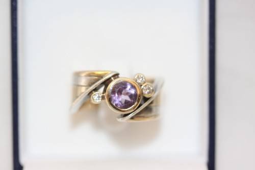 A beautiful 14ct yellow gold and sterling silver ladies ring w/ diamonds and a large Amethyst stone