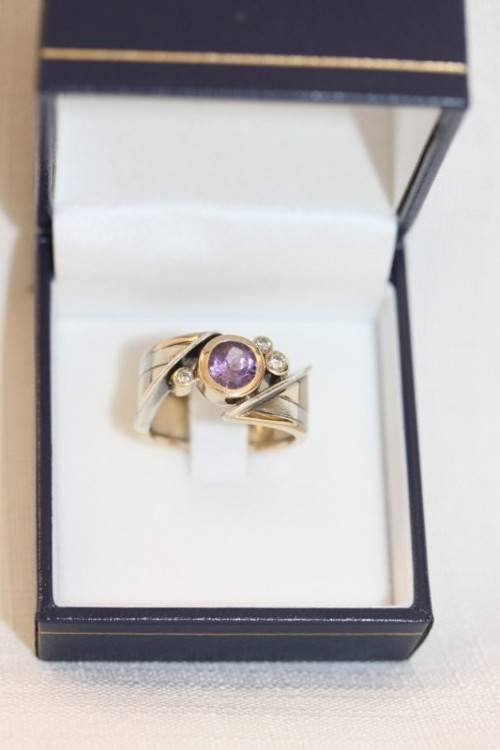 A beautiful 14ct yellow gold and sterling silver ladies ring w/ diamonds and a large Amethyst stone