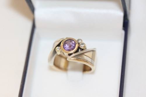 A beautiful 14ct yellow gold and sterling silver ladies ring w/ diamonds and a large Amethyst stone