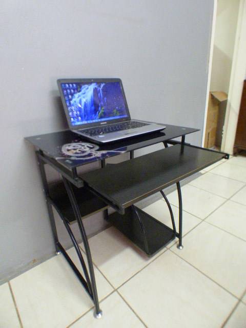 A lovely glass top writing/computer desk in good condition. Lovely in a ladies room.