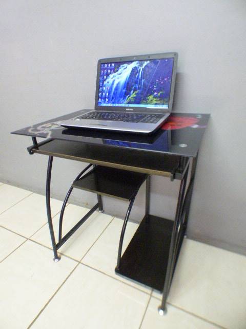 A lovely glass top writing/computer desk in good condition. Lovely in a ladies room.