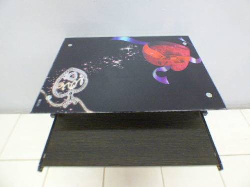 A lovely glass top writing/computer desk in good condition. Lovely in a ladies room.