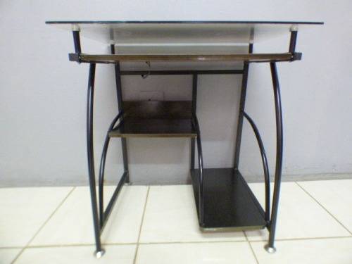 A lovely glass top writing/computer desk in good condition. Lovely in a ladies room.