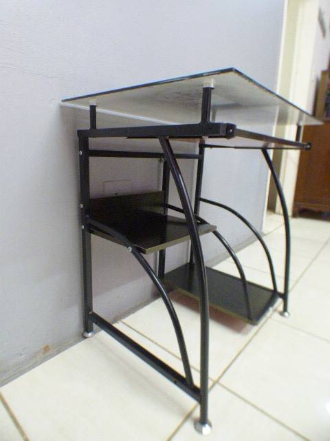 A lovely glass top writing/computer desk in good condition. Lovely in a ladies room.