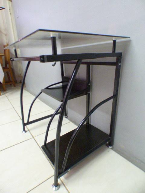 A lovely glass top writing/computer desk in good condition. Lovely in a ladies room.