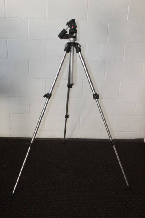 A durable and good quality Manfrotto 190D tripod with a strap in the original box