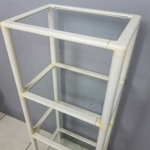 A fabulous 4-tier multi-purpose glass shelf display stand in good condition