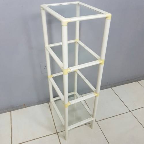 A fabulous 4-tier multi-purpose glass shelf display stand in good condition