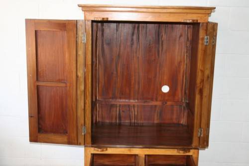 A magnificent Indonesian teak entertainment cabinet with traditional solid brass embellishments