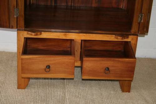 A magnificent Indonesian teak entertainment cabinet with traditional solid brass embellishments
