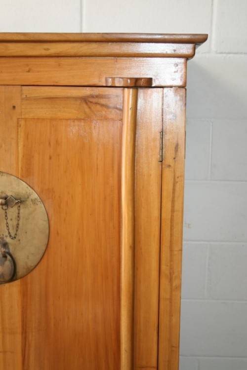A magnificent Indonesian teak entertainment cabinet with traditional solid brass embellishments
