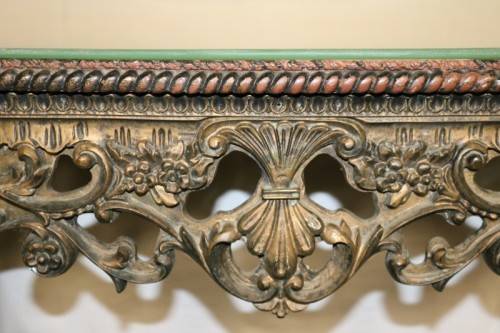 A fabulous antique wall mountable display shelf with amazing ormolu detailing and a glass top