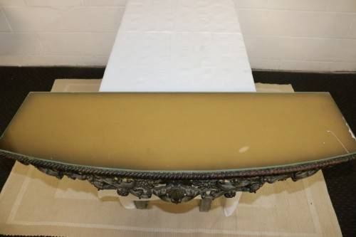 A fabulous antique wall mountable display shelf with amazing ormolu detailing and a glass top