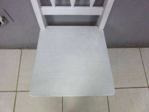 A solid wooden white dining in good condition - perfect for a beach house!