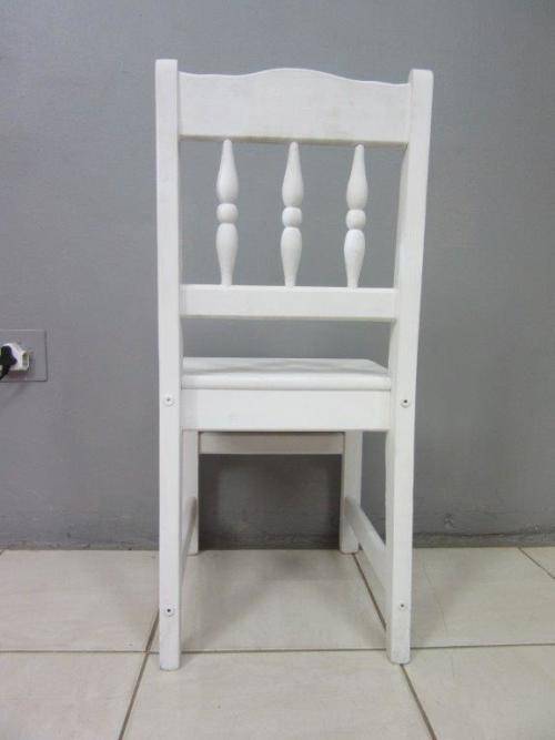 A solid wooden white dining in good condition - perfect for a beach house!