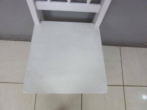 A solid wooden white dining in good condition - perfect for a beach house!